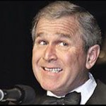George W Bush laughs as he lets off